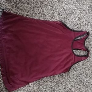 Maroon athletic shirt.